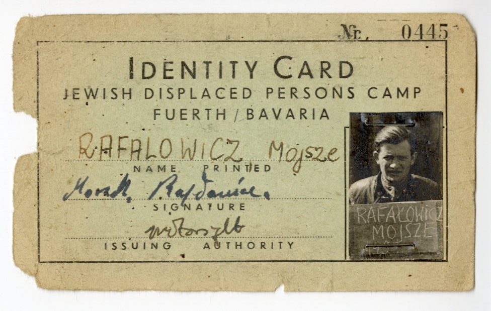 identity card for Jewish displaced persons camps in Bavaria. The name on the card is Rafalowicz, Mojsze and te card includes a photo of Mr. Rafalwicz