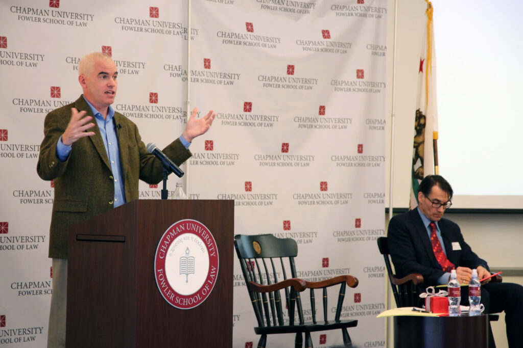 Dean James Gibson talking at podium