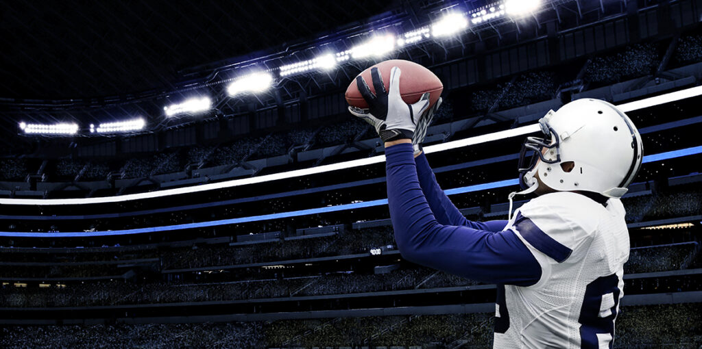 Buffalo Bills All-Pro Linebacker Shawne Merriman catching a ball at game