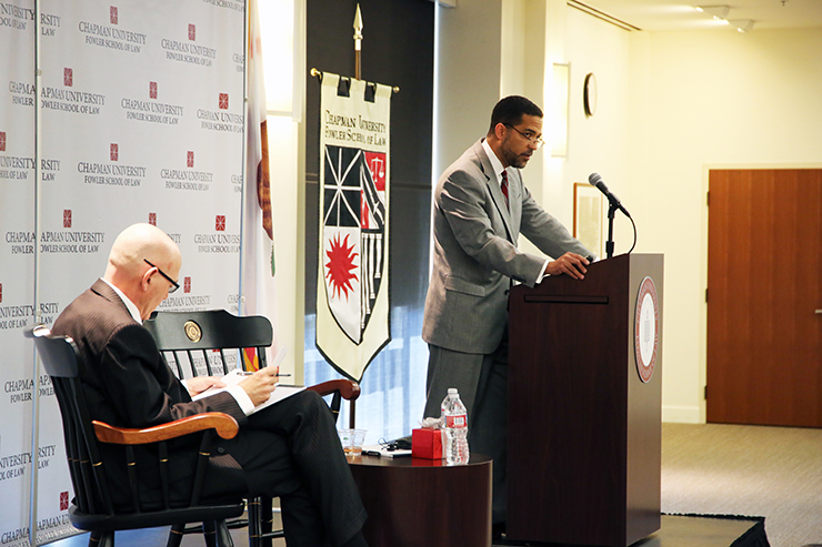 Ramsey Clark talking at podium