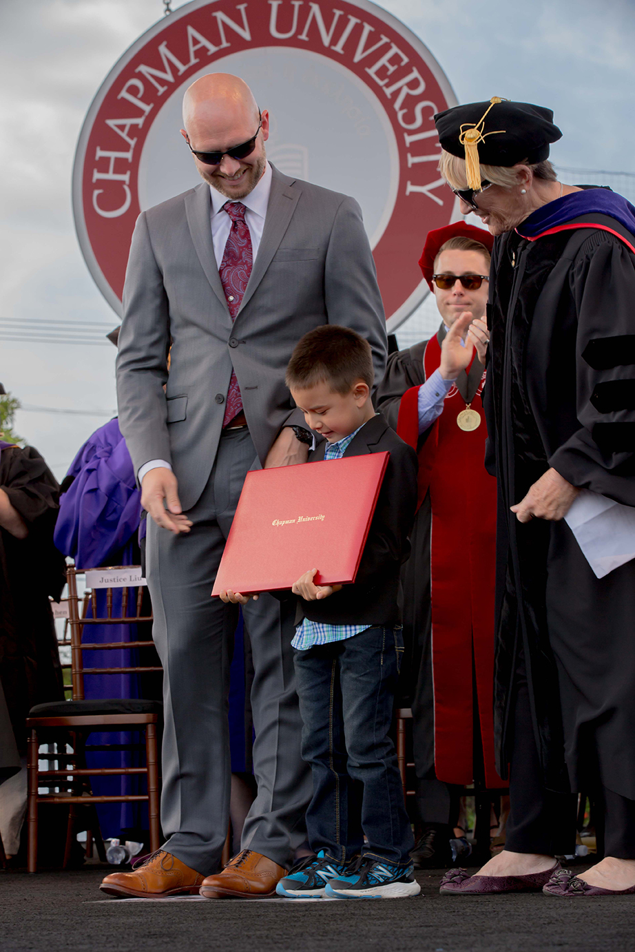 Annie Lin's husband and son accept her degree posthumously