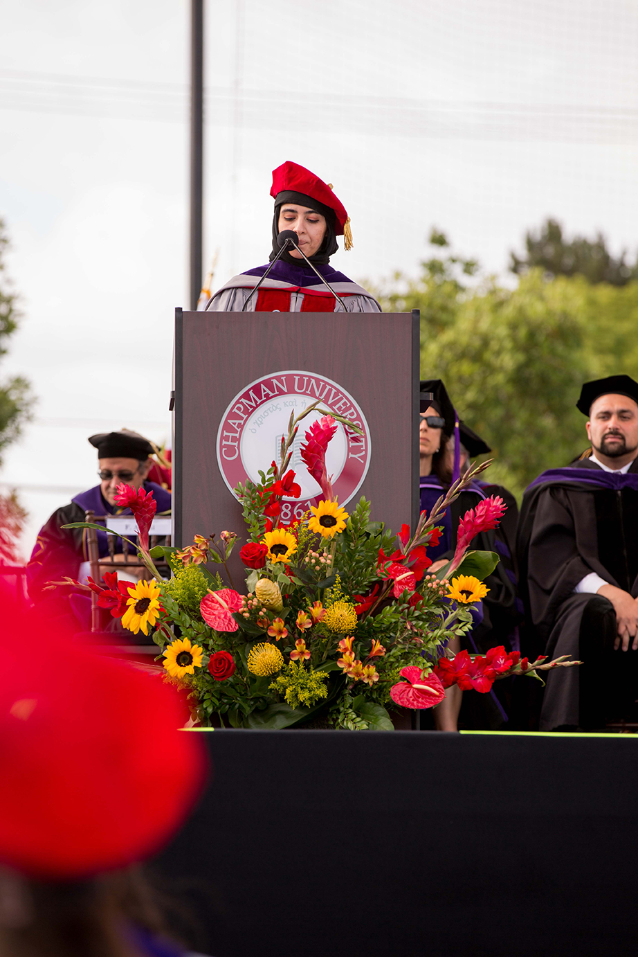 Fahima Amini delivers the LL.M. response at podium