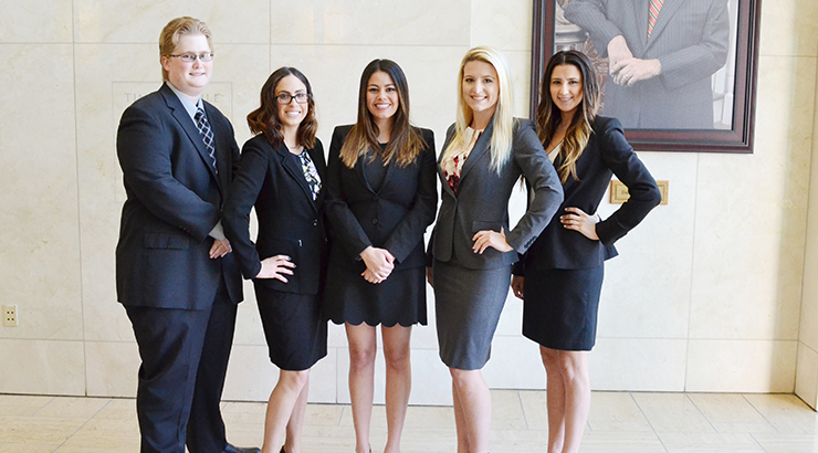 Law students posing in Kennedy Hall Lobby