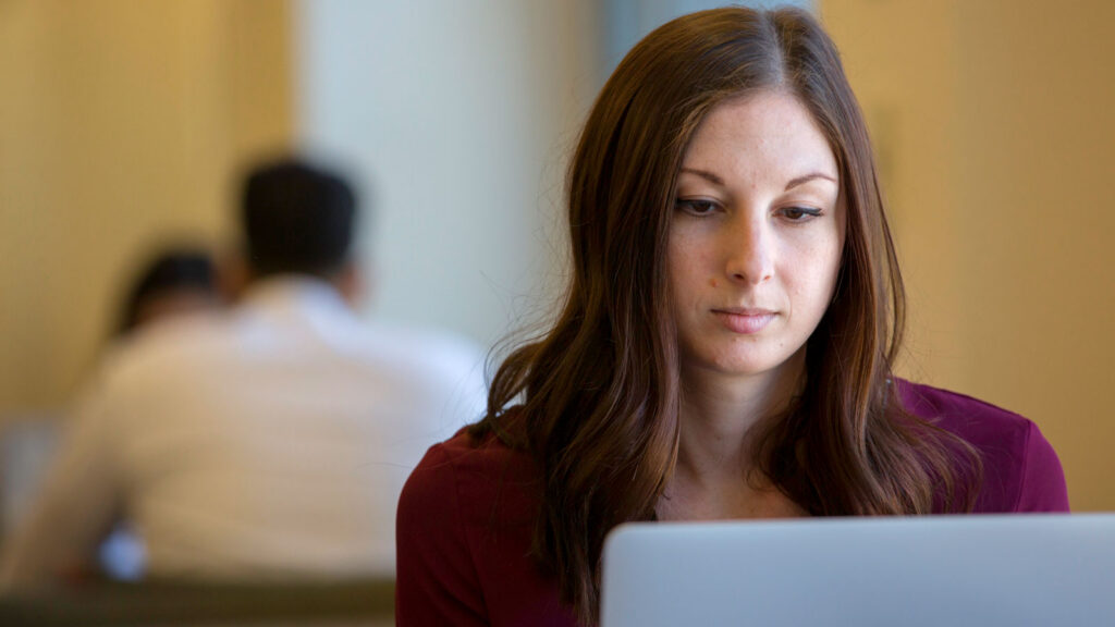Law student looking at laptop computer