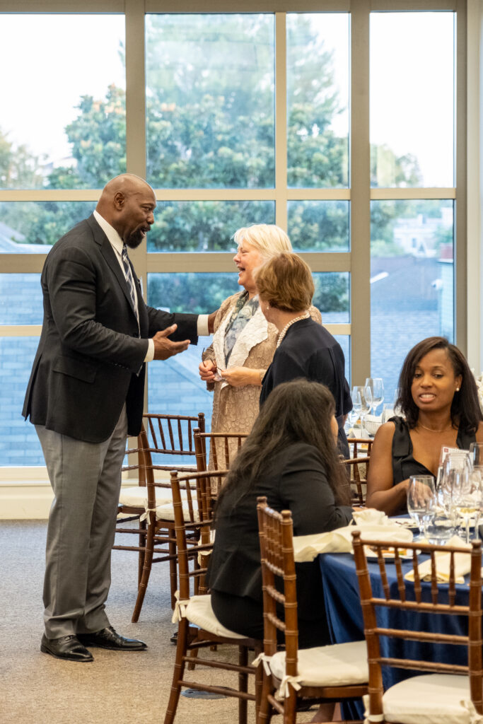 Photo of a guest engaging in conversation with keynote speaker Kellye Y. Testy president and chief executive officer of the Law School Admission Council
