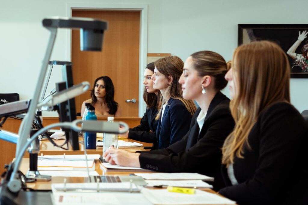 Potograph of contestants being briefed by the judges
