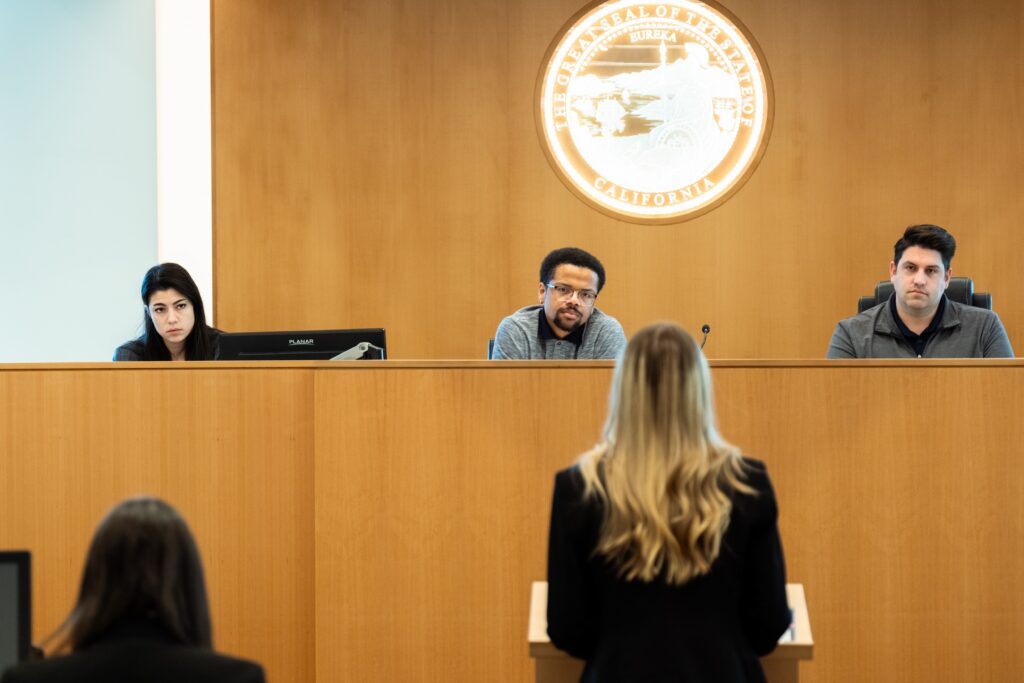 Photograph of a contestant appearing before the judging panel