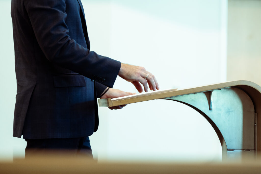 Photograph of a contestant presenting to the judging panel