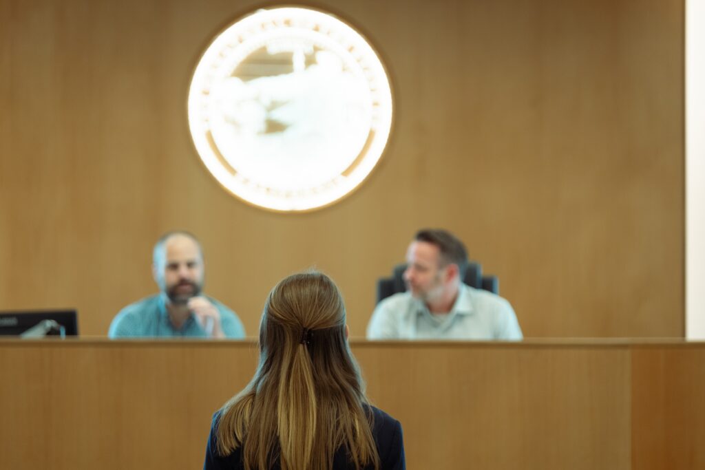 Photograph of a contestant appearing both the judges.