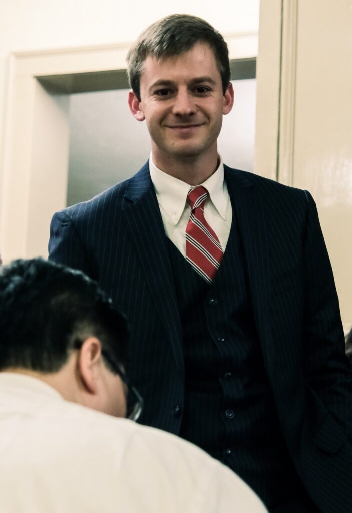 Graduate and newlt barred attorney JT Johns awaits Judge Vu's signature
