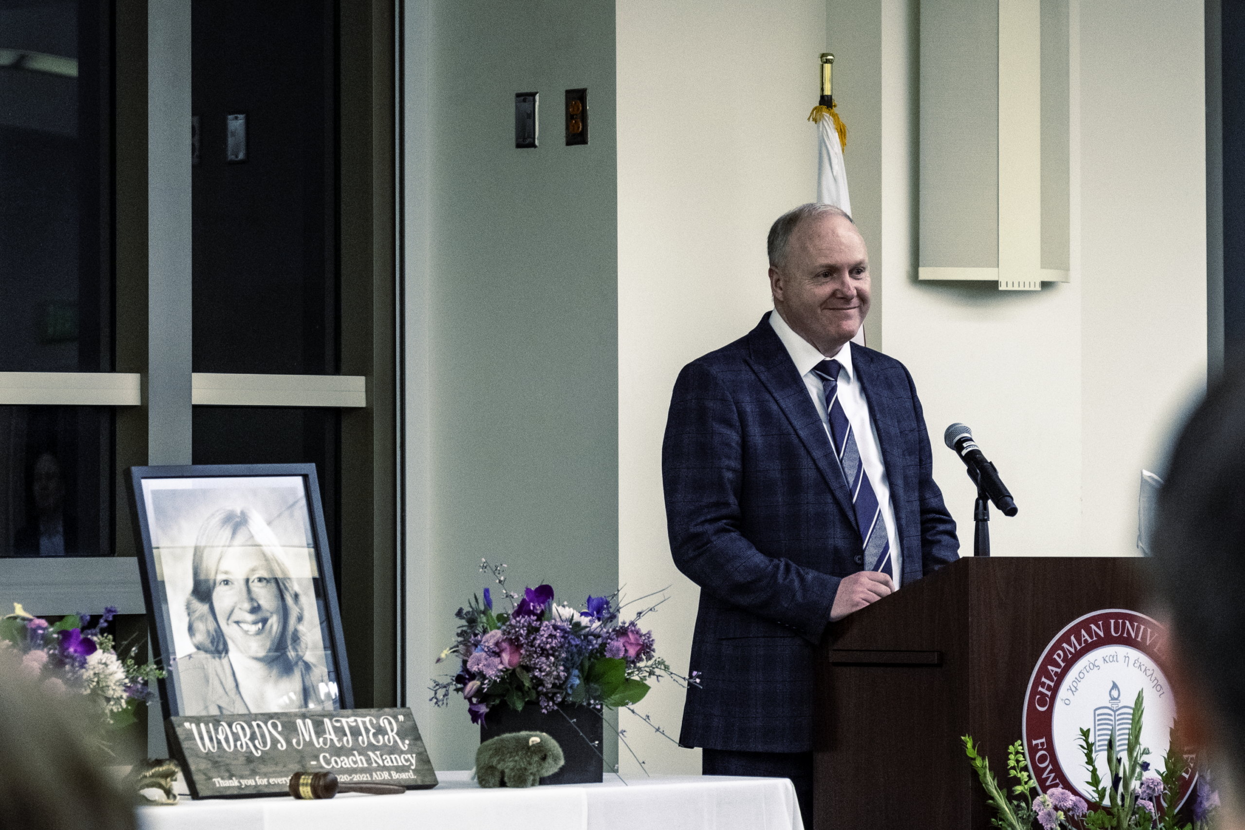 Photograph of a speaker at the memorial for Professor Nancy Schultz