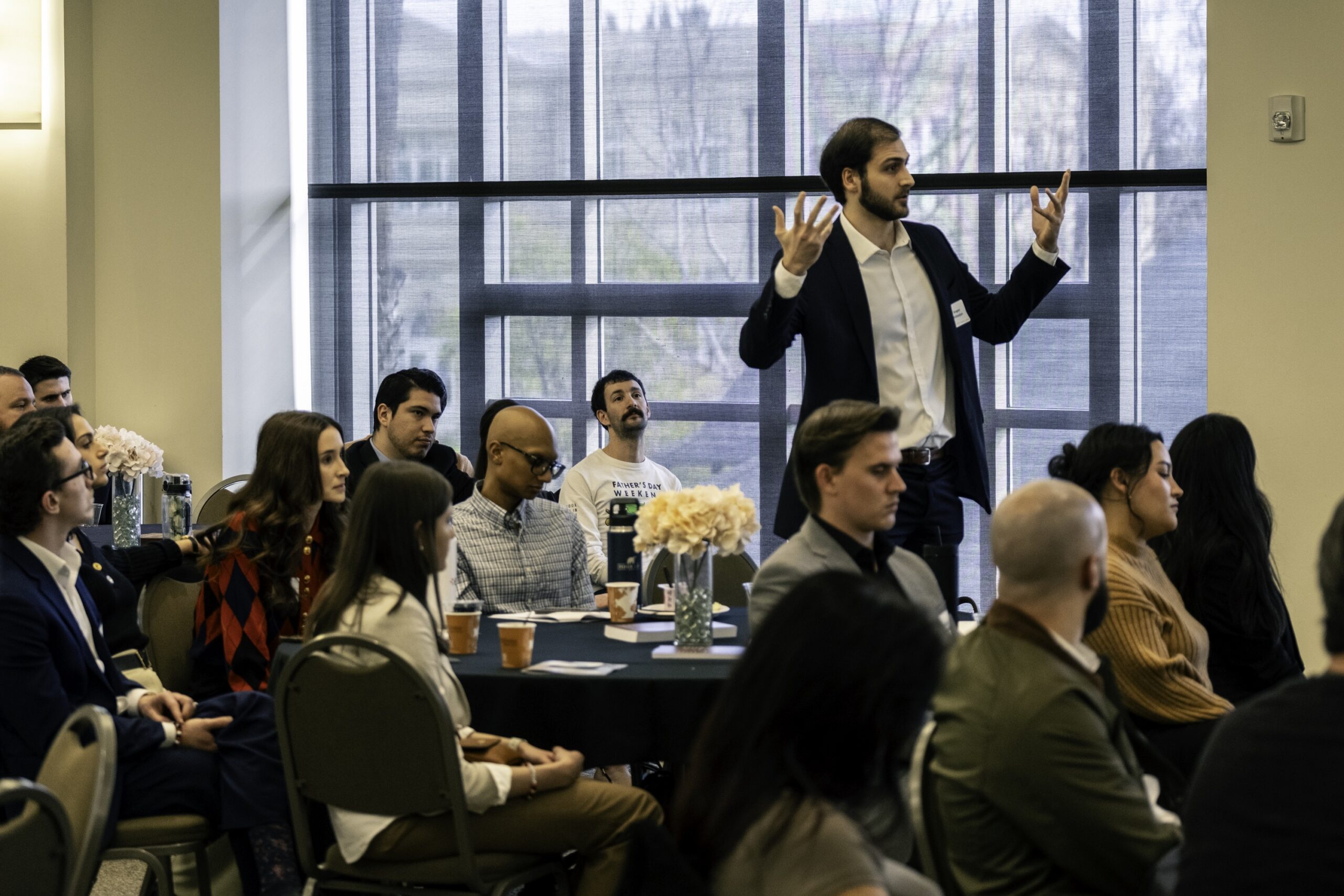 Photograph of a Fowler student asking the panel a question at the 2024 Chapman Law Review Symposium