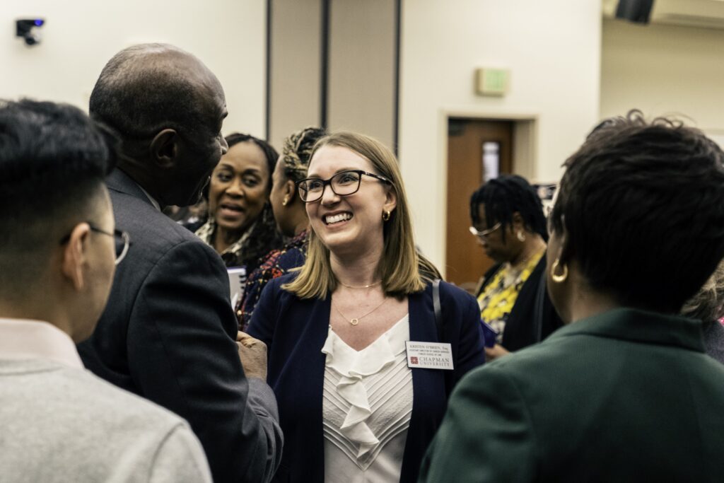 Photograph of Fowler School of Law's Kristin O'Brien meeting Justice Martin J. Jenkins