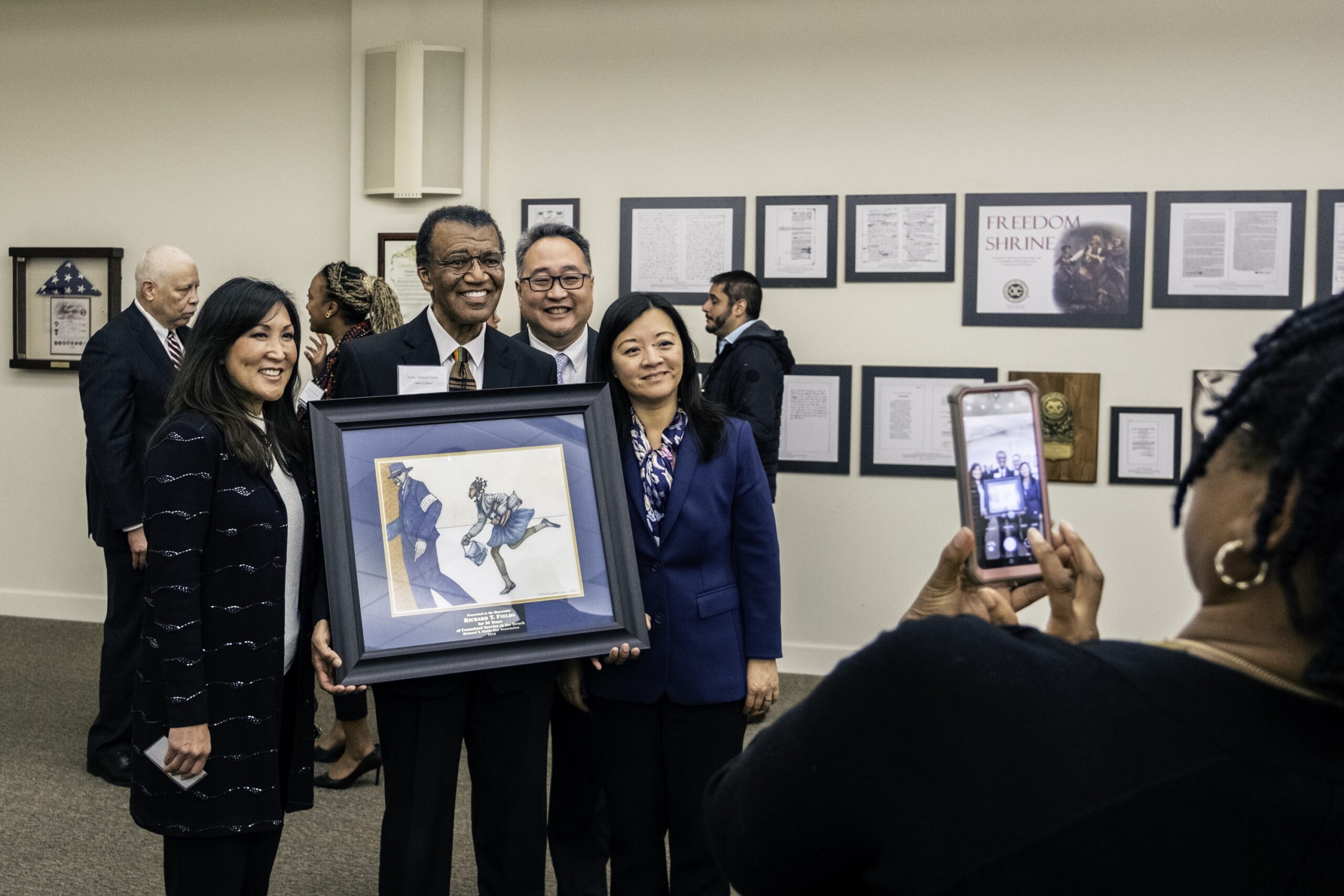 Photograph of Justice Richard T' Fields, pictures with (from left) Hon. Richard Y. Lee, and Mei Tsang, Esq.