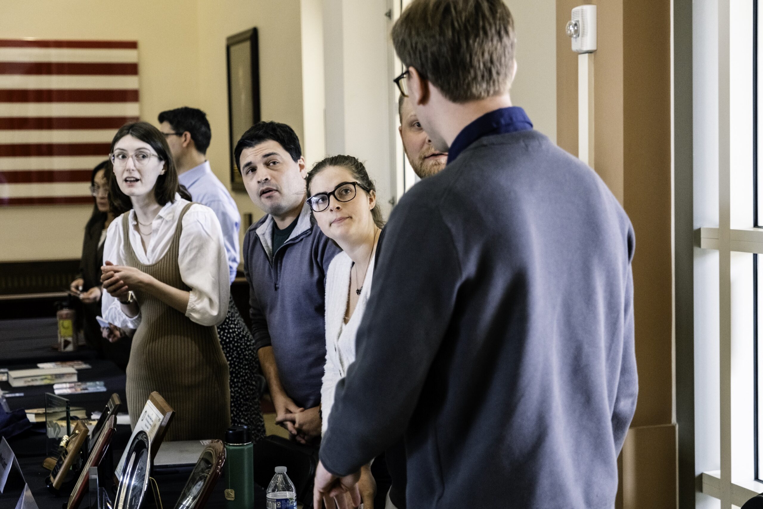 Photograph of a Chapman Law professor speaking with students from the Fowler Law competition teams during scholars weekend