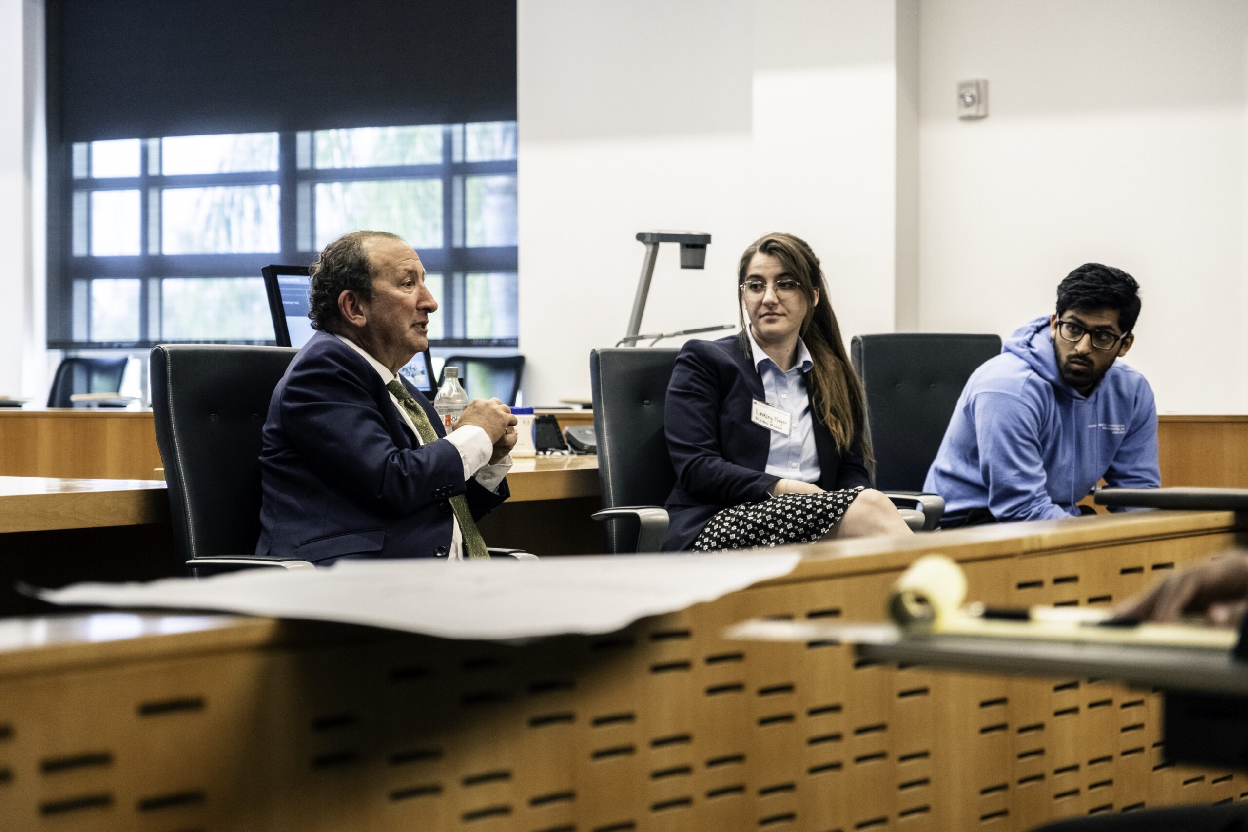 Photograph of a Chapman professor and alumni addressing prospective students during scholars weekend