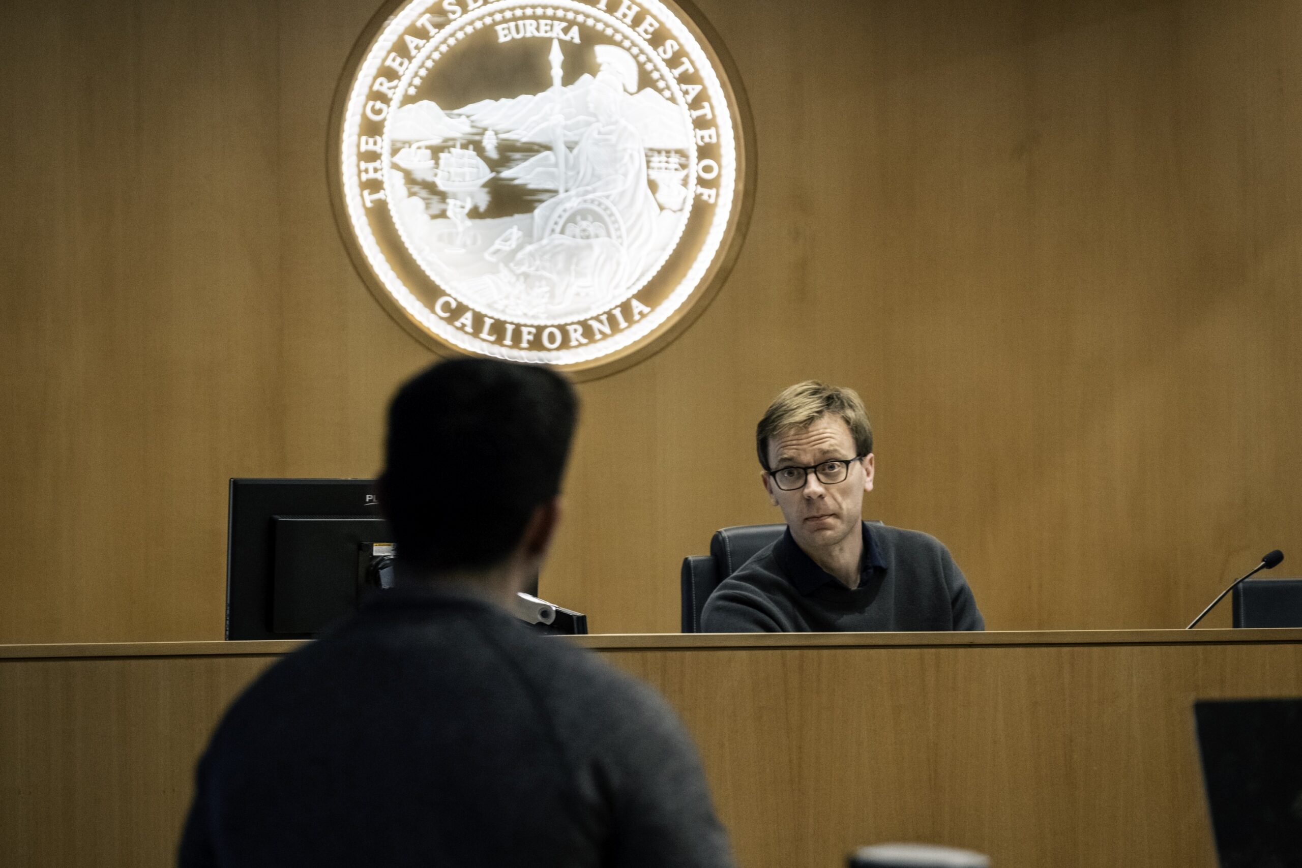 Photograph of a Chapman professor as "judge" during a mock trial exercise on scholars weekend