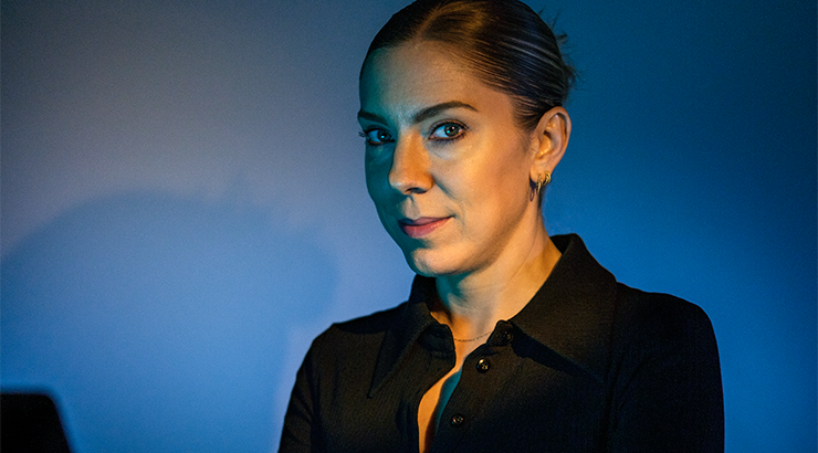 Photograph of Kaitlin Peterson at her workstation
