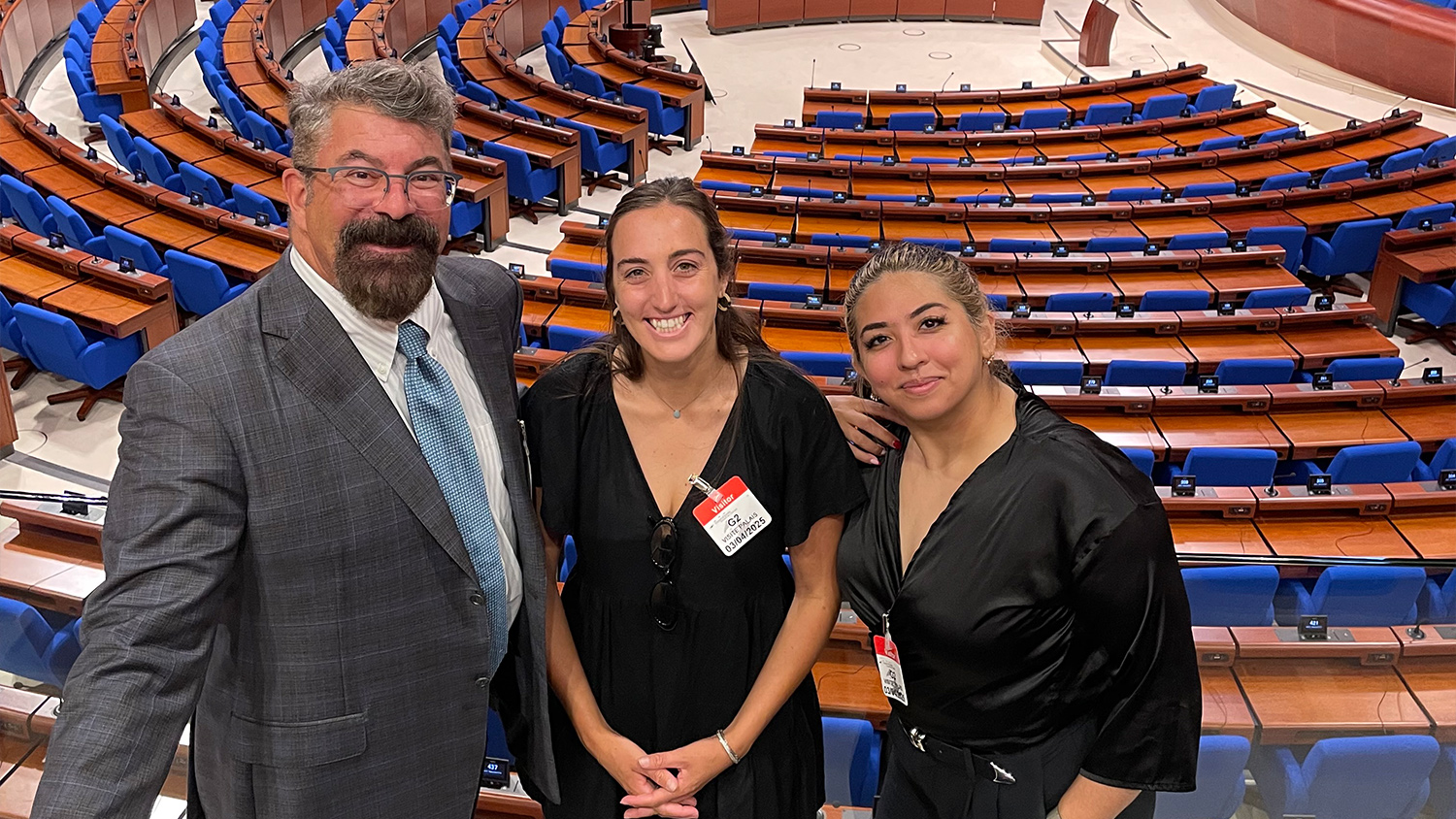 Dean Paton with FSOL students Megan Dillon and Christine Panshi in the Council Chamber of the Council of Europe