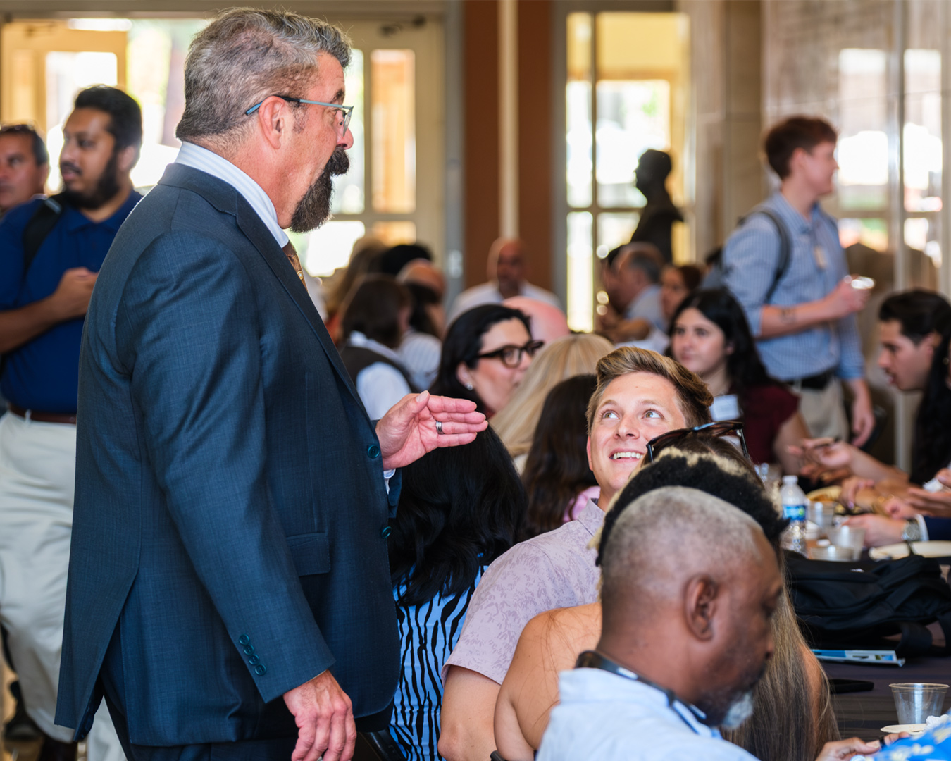 Photo of Dean Paton in conversation with a 1L students