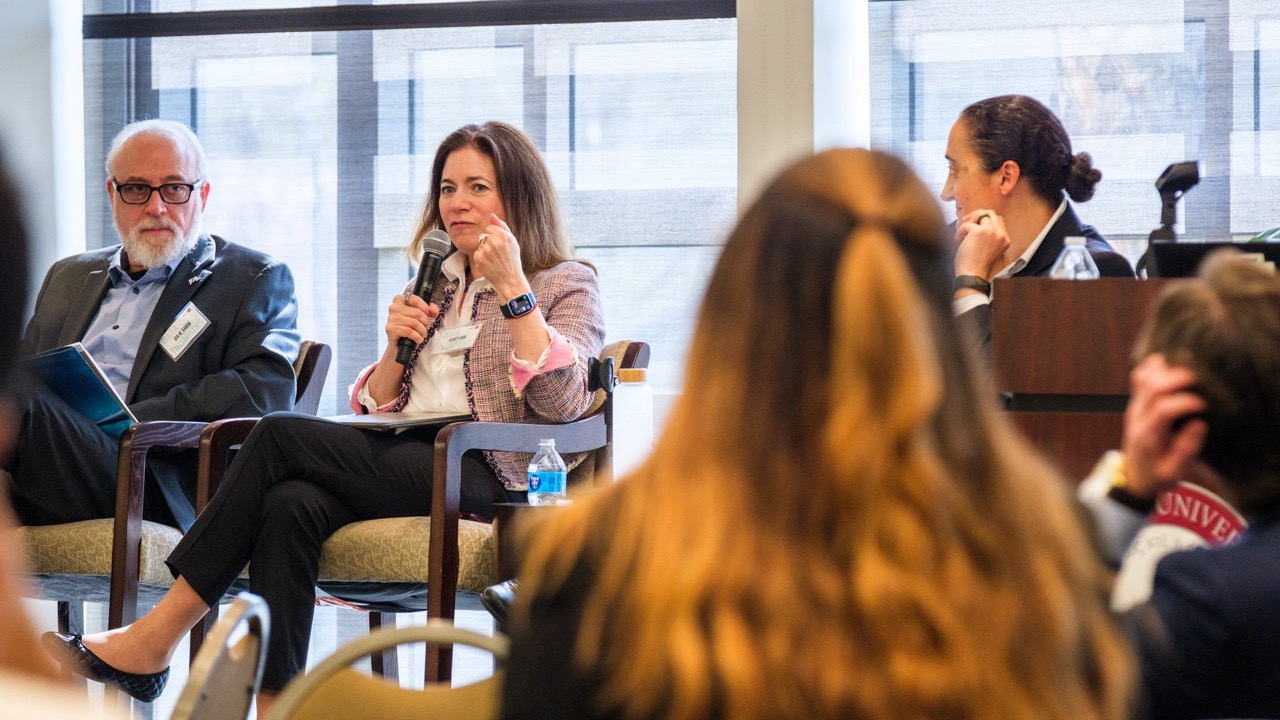Panelists respond to the moderator's question.