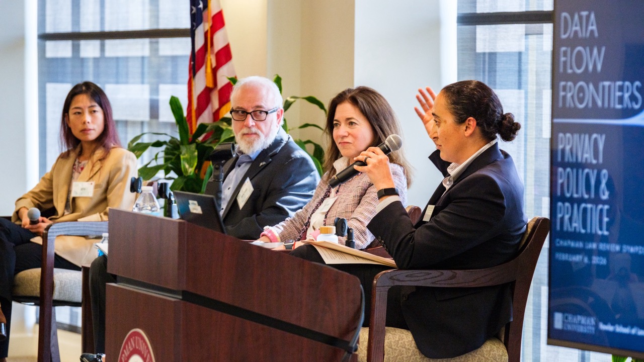Panelists listen attentively to a question from the moderator of their panel.
