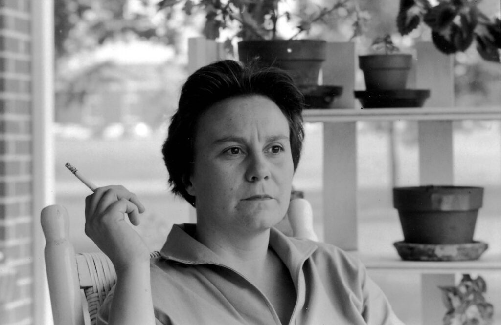 Harper Lee holding a cigarette.