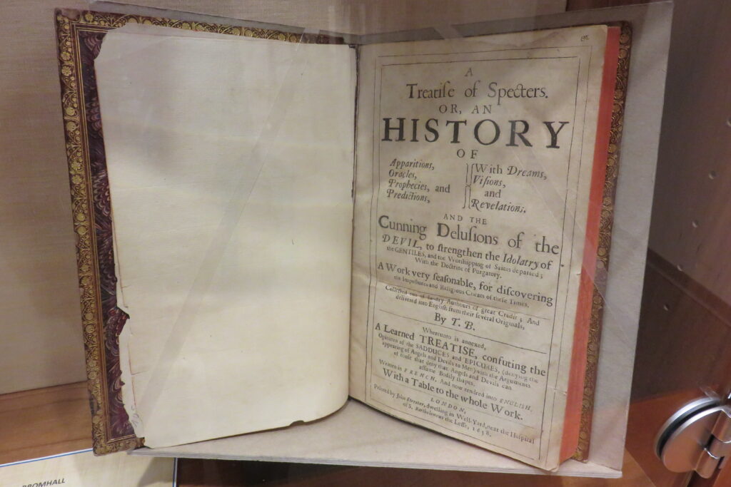 Book on magic and witchcraft on display.