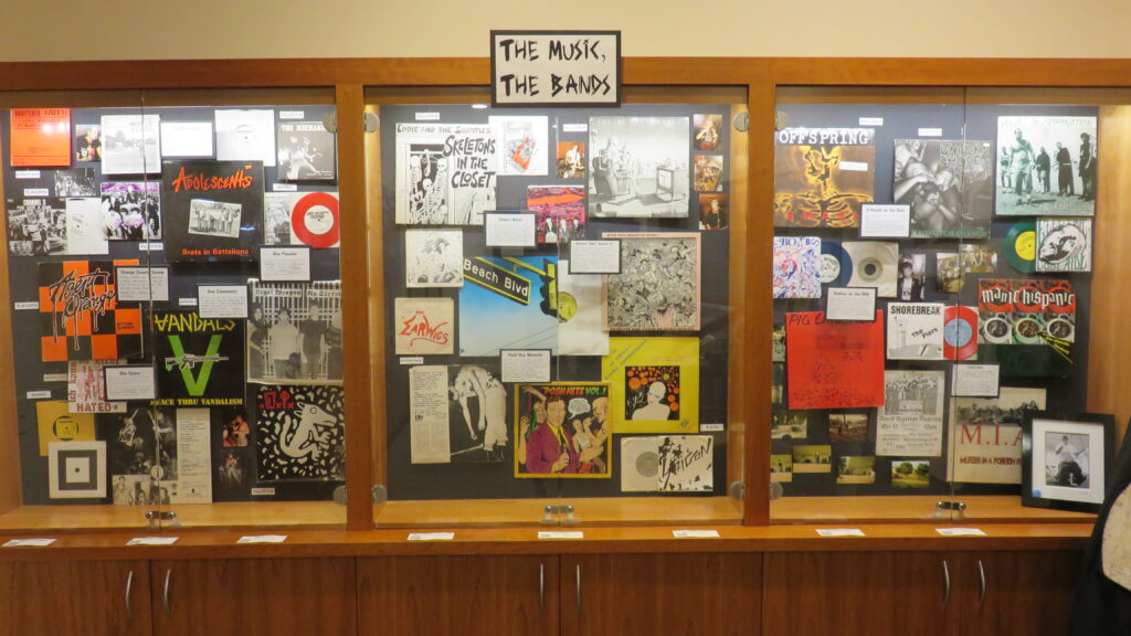 Large view of half of the display, with material behind glass in a cabinet