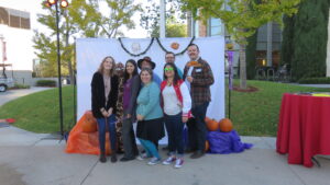 A group of people stand posed together
