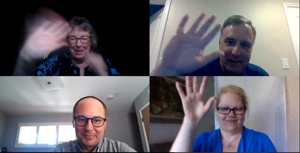 Screenshot of a Teams meeting. In each of the four boxes into which the screen is divided is a person smiling and waving.