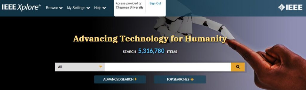 Header for the IEEE Electronic Library, which shows a search bar under the heading "Advancing Technology for Humanity" over an image of a Black person's hand touching fingertips to the hand of a robot.