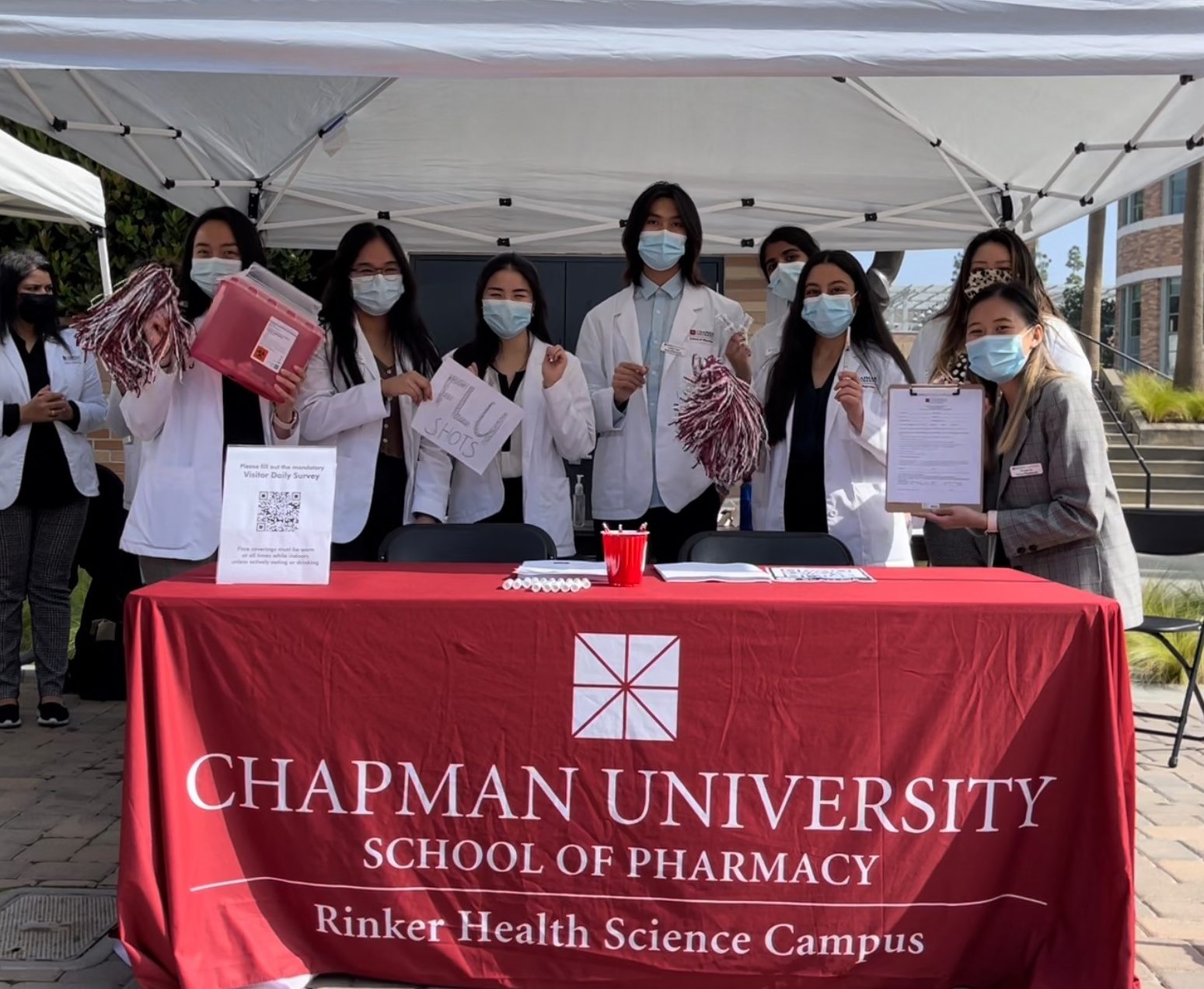 student pharmacists at the health fair booth