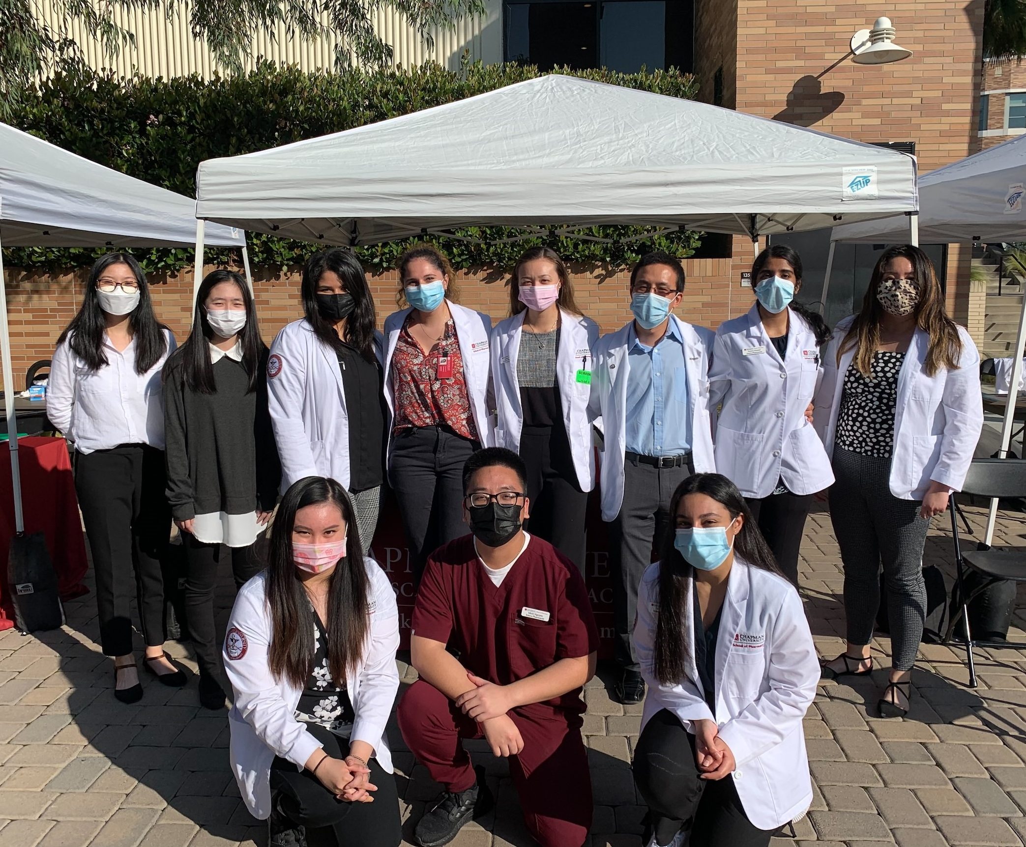 CUSP alumni and students at the health fair booth