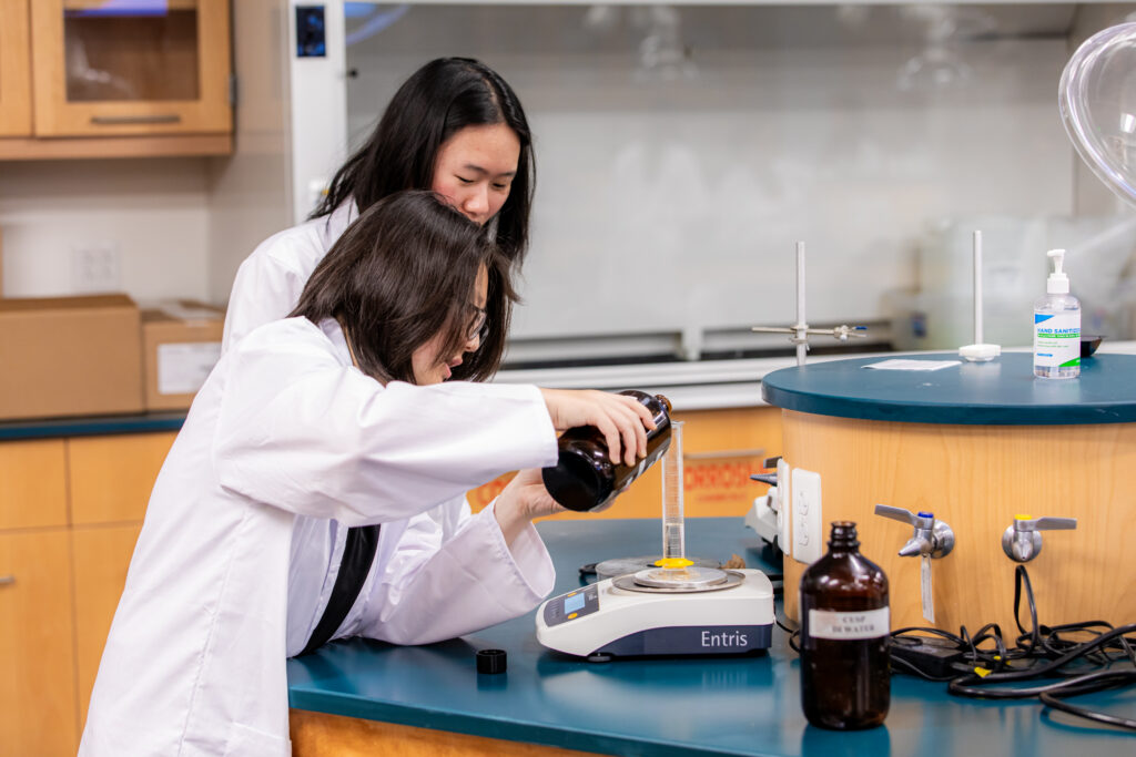 2 students conduct an experiment