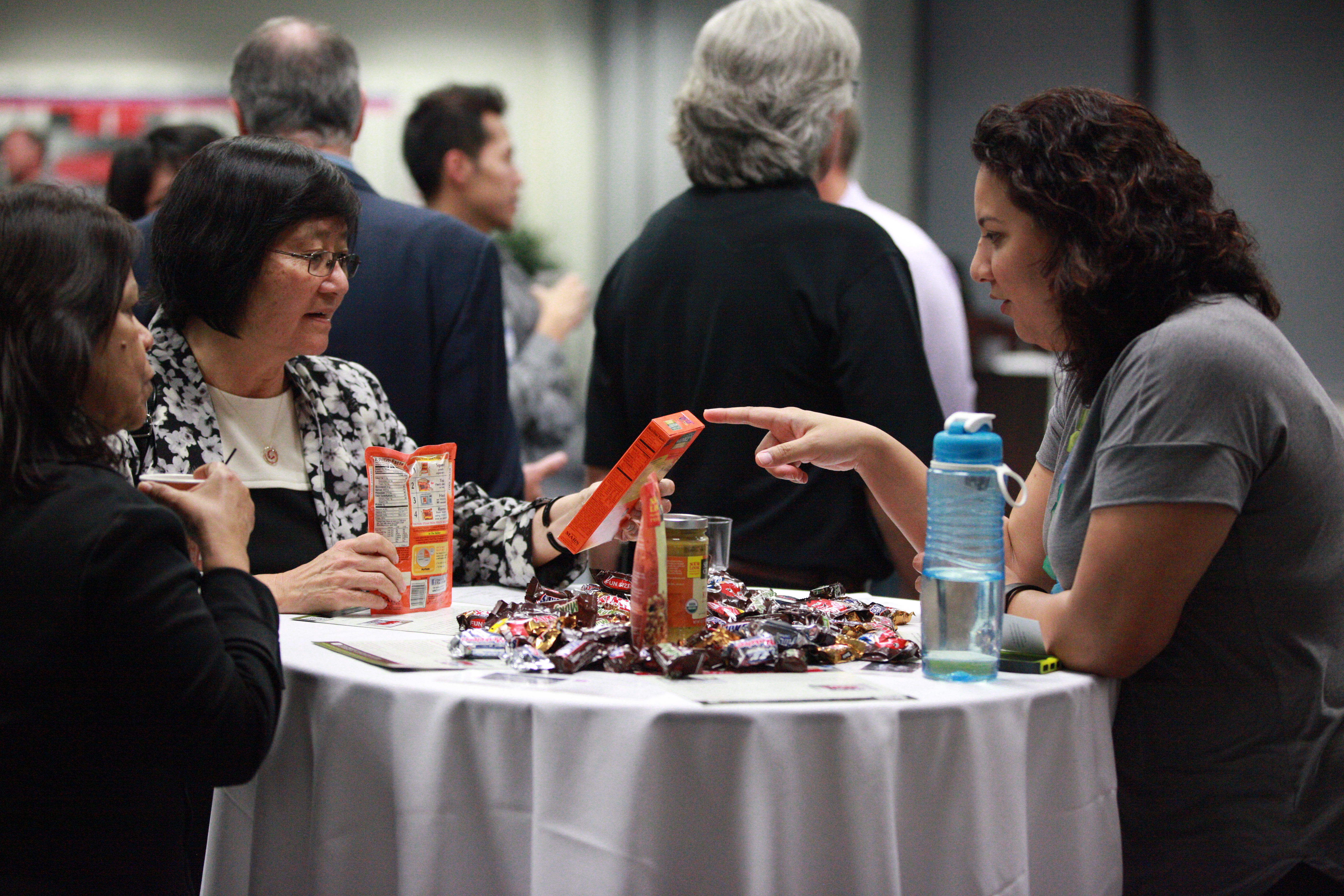 Maria Villegas Rodriquez (MBA '13), Talent Acquisition Manager for Mars Food, NA, showcasing some of their company products.