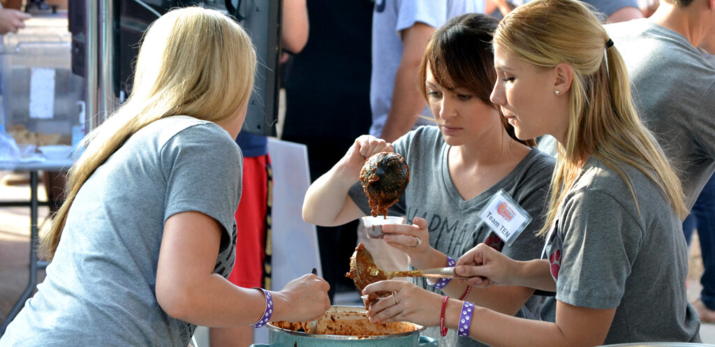 People serving chili