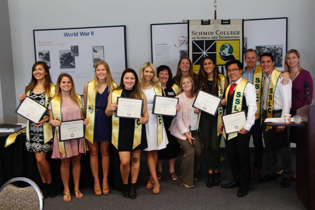 Schmid Student Leadership Council members with certificates and stoles at 2016 Senior Awards banquet