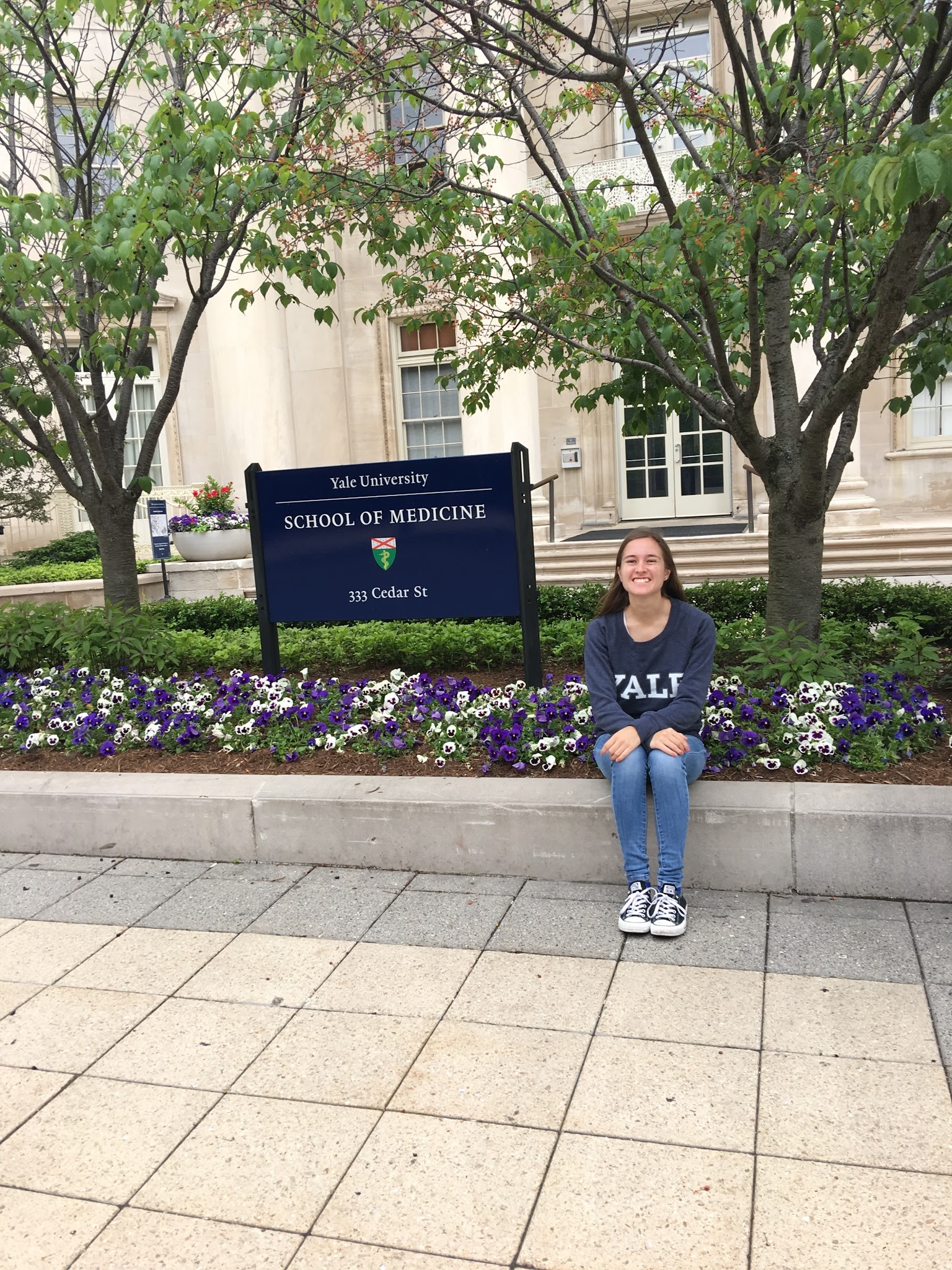 Sara Siwiecki sitting outside Yale's School of Medicine where she's participating in a REU.