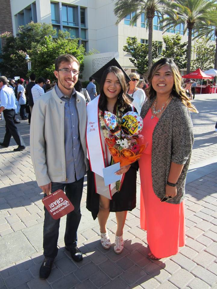 adam kalawi with mentee at their graduation