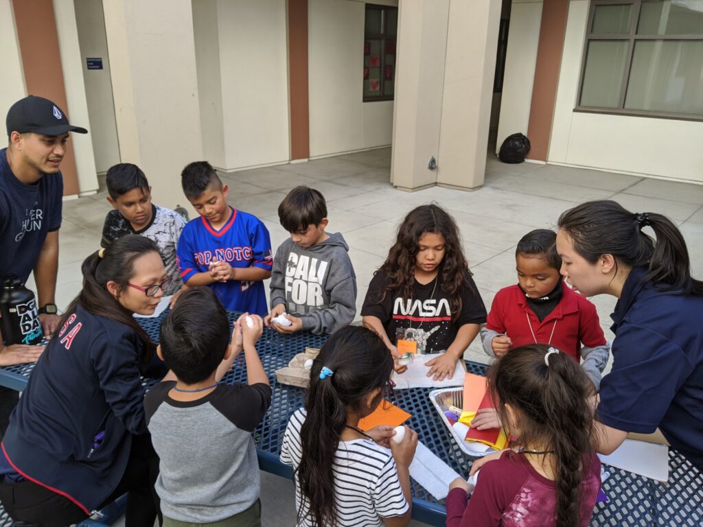 Chapman students working with children at Higher Ground