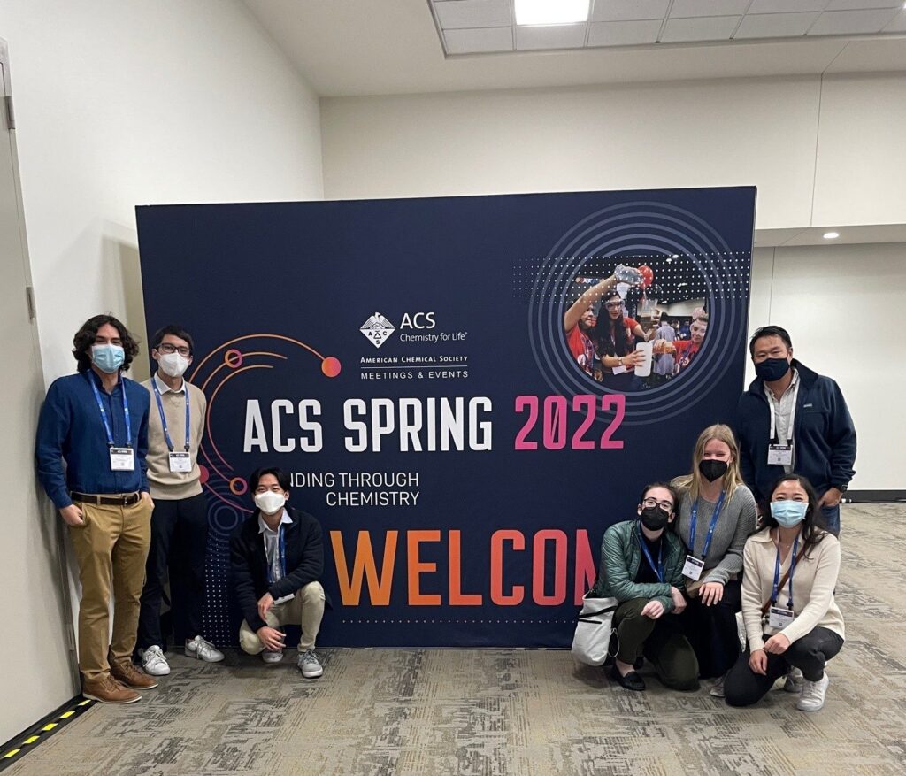 Students in front of ACS 2022 sign