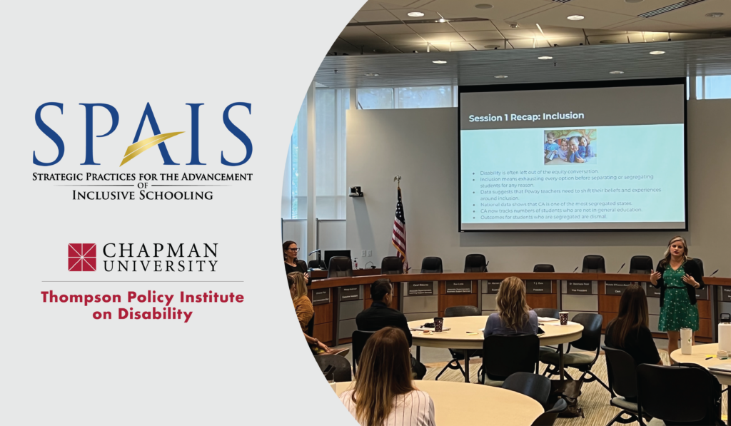 Dr. Audri Gomez is presenting in front of a group of teachers sitting at round tables.