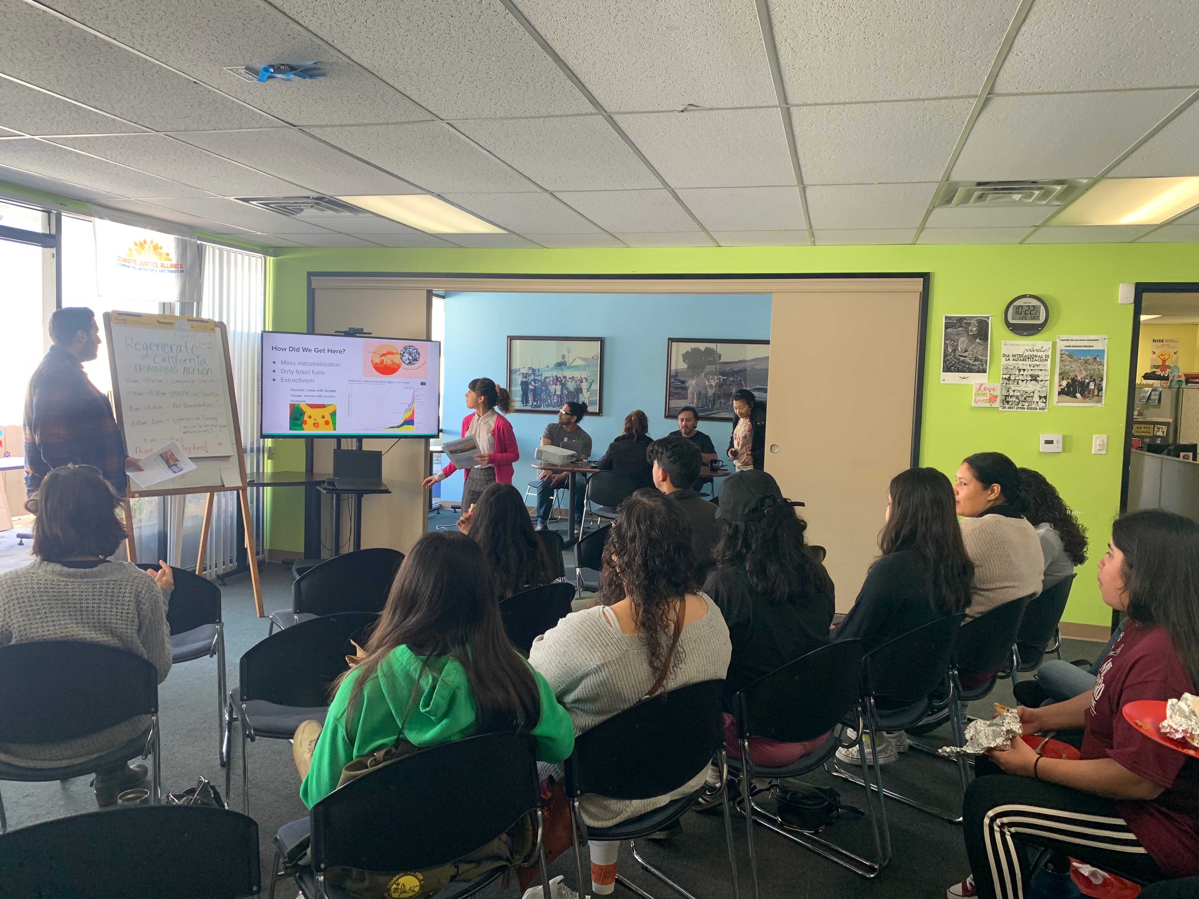 Alexis presenting in front of community members