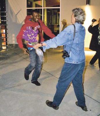 Two people about to hug.