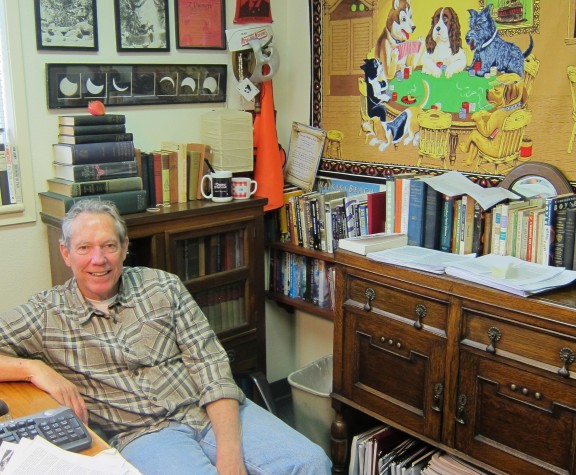 Man smiling in office.