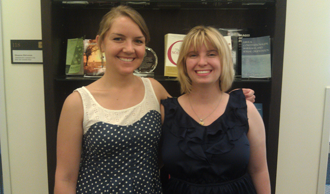Two women smiling.