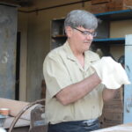 Man making pizza.