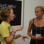Two women talking.