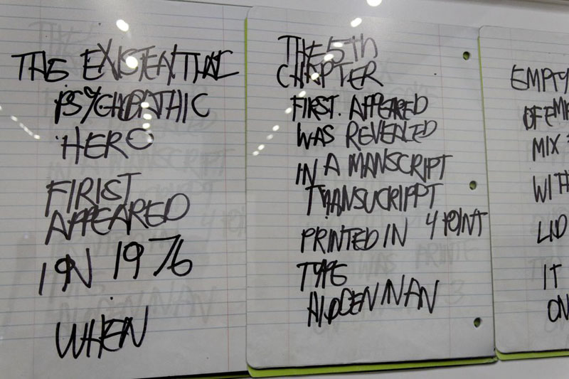 Writing in notebooks with marker.